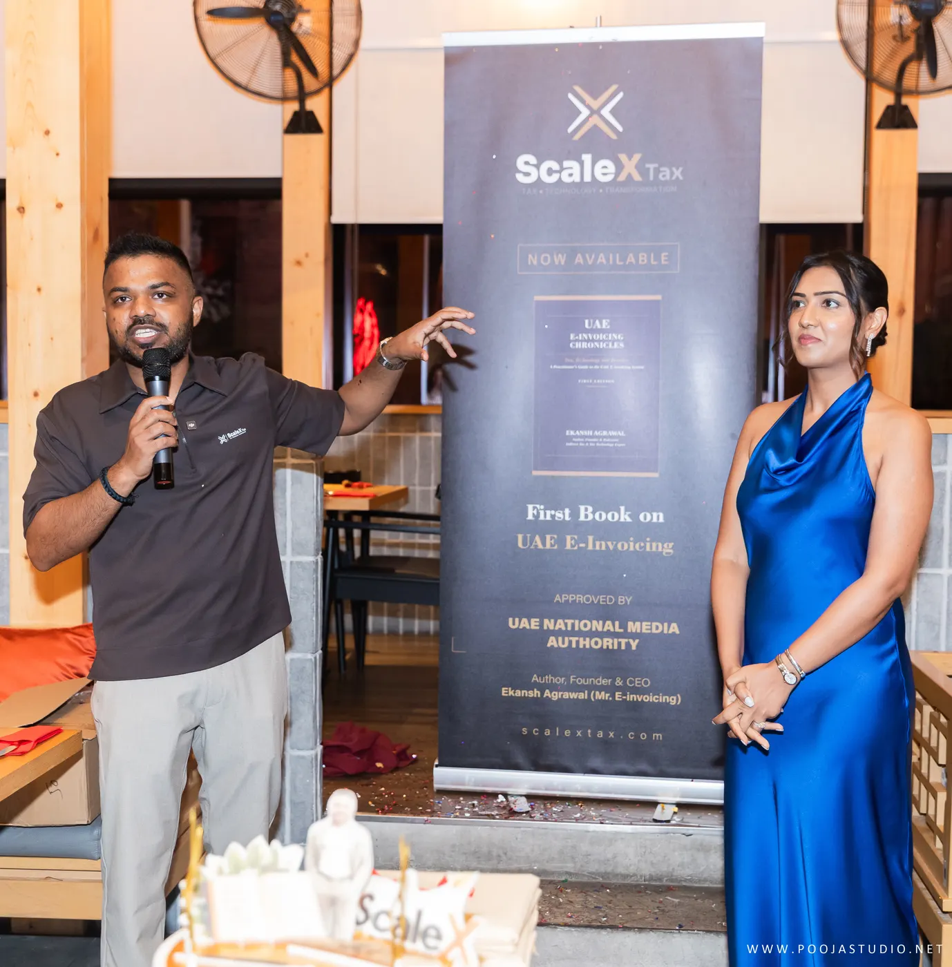 Ekansh Agrawal presenting beside the UAE E-Invoicing Chronicles banner