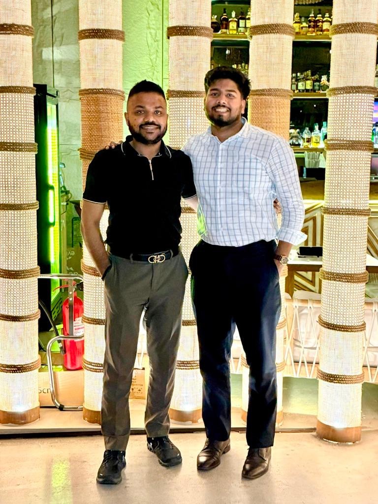 Ekansh Agrawal with team member at ScaleX Tax event